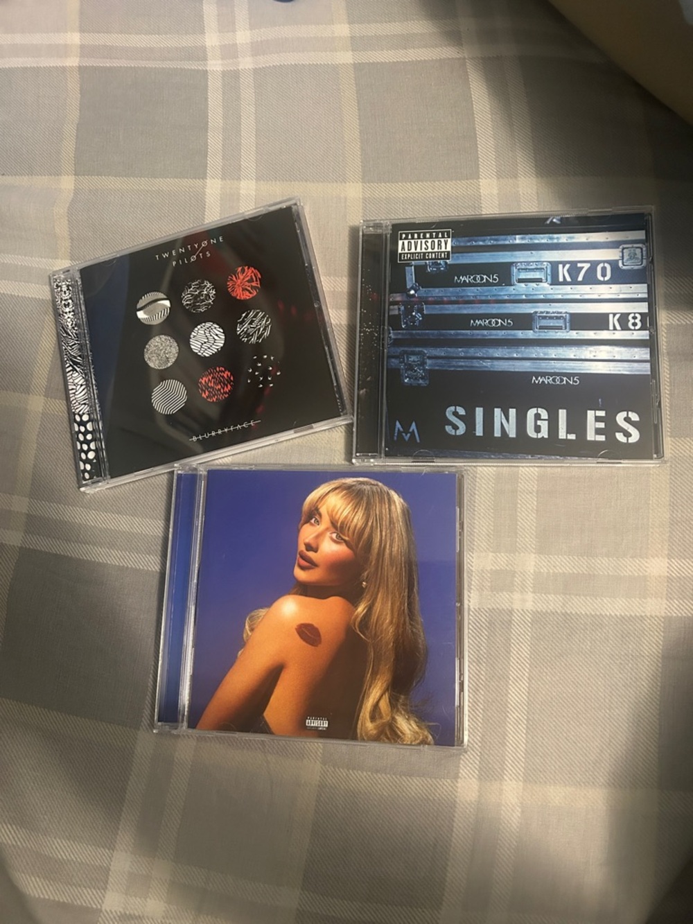 Three Music CDs - Twenty One Pilots, Maroon 5, Sabrina Carpenter